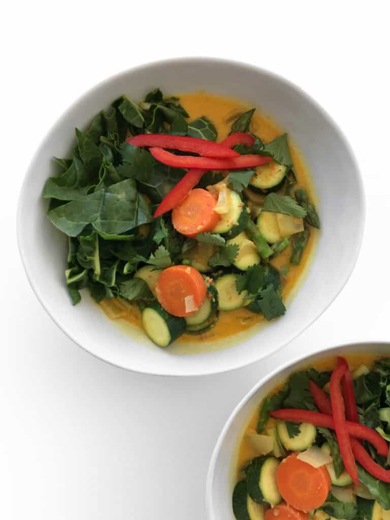 Healthy Thai Coconut Curry with vegetables. Garnish with cilantro, red bell pepper and enjoy with rice | StarseedKitchen.com