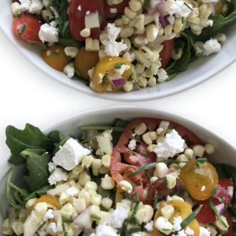 Tomato and Corn Salad with red onion, feta, arugula and chives